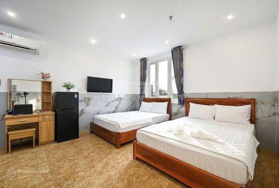 Bán nhà trần quốc hoàn 87m²  khách sạn hầm + 6 tầng  20 phòng  thu 1.4 tỷ/năm  giá 36 tỷ