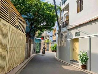 Bán nhà hẻm xe hơi cách mặt tiền đường lê quang định 80m ngang 6,4m dòng tiền 30triệu/t. giá 12,8tỷ