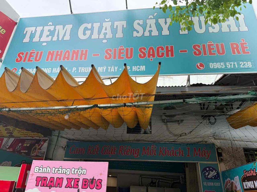 sang tiệm giặt sấy